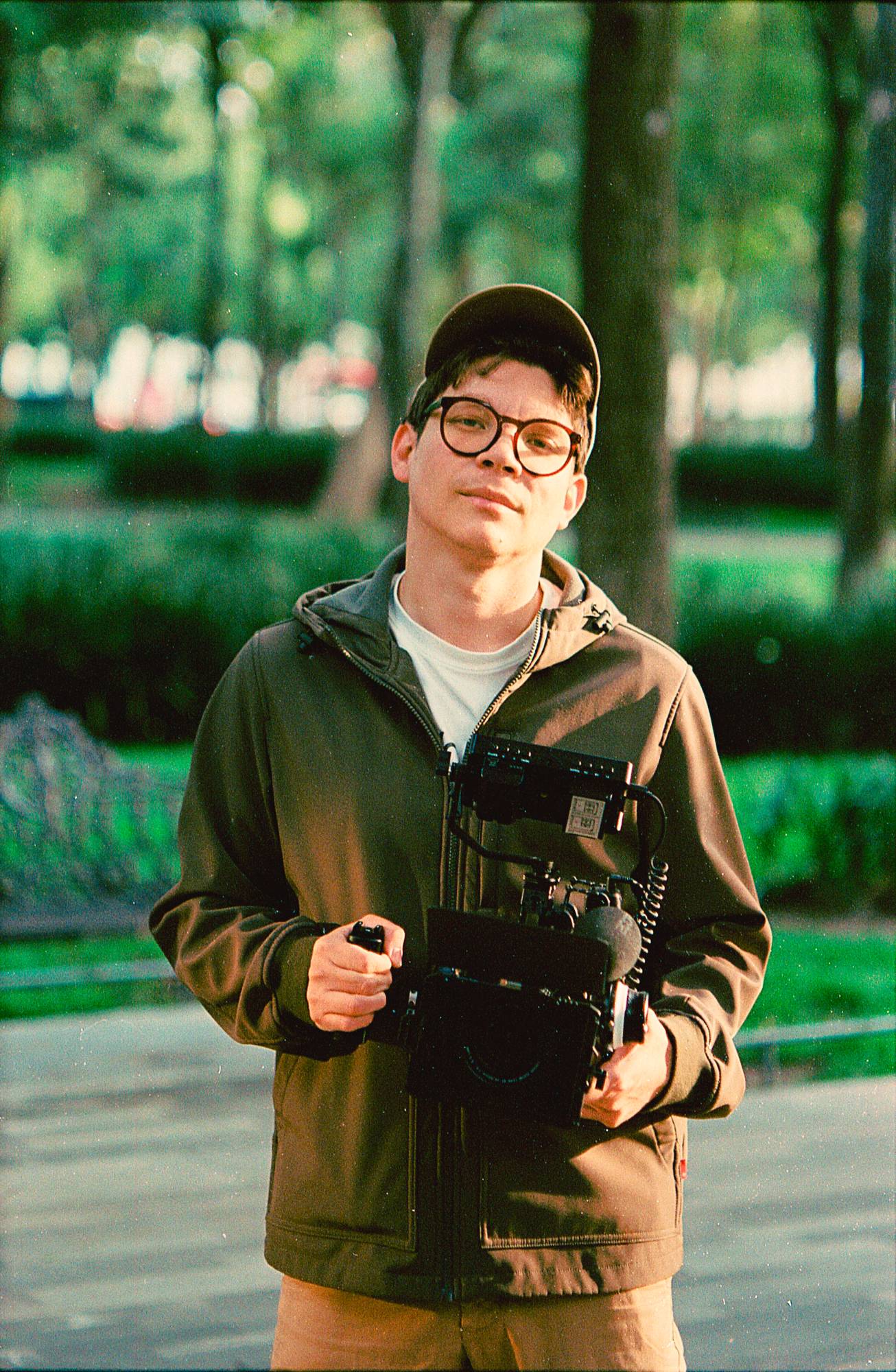 Irving Perez holding video production gear outdoors
