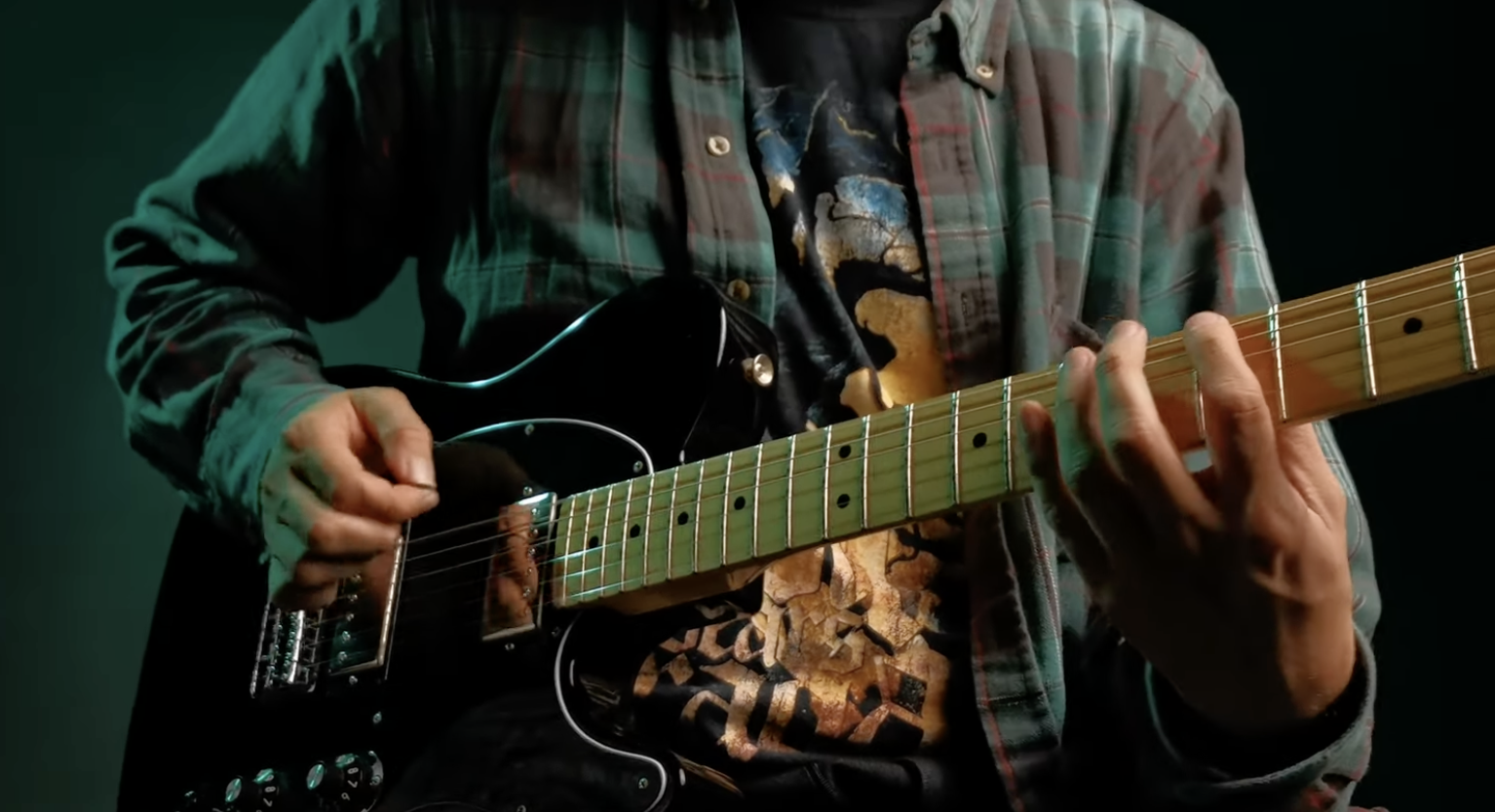 Close-up of Irving playing guitar during the HUAWEI camera test